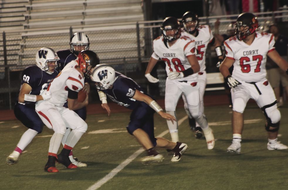 Beaver quarterback Nate Lesher gets sacked in the first quarter.